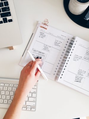 setting out the dates and events in a notebook